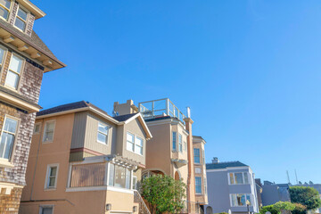 Facade of houses with different wall sidings in a low angle view in San Francisco, California