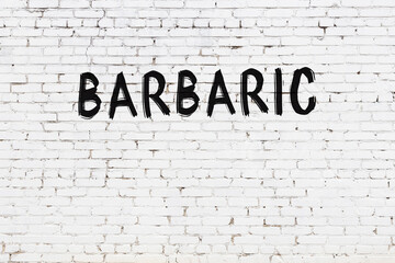 Inscription barbaric painted on white brick wall - obrazy, fototapety, plakaty