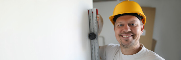 Smiling happy handyman at work