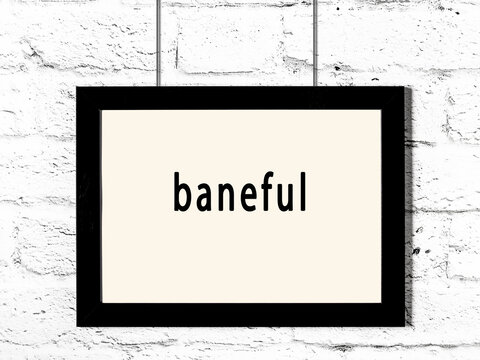 Black frame hanging on white brick wall with inscription baneful