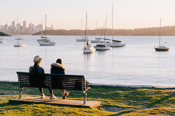 Australian couples looking and enjoy beautiful landscape view of Sydney cityscape and harbour...