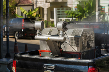 Bangkok, Thailand - January, 24, 2022 : Car with machine spraying to eliminate mosquito for preventing spread dengue fever and zika virus at Bangkok, Thailand. - 499945184