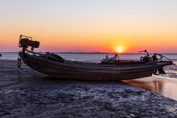 Fototapeta premium Wooden fishing boats on the coast in the evening