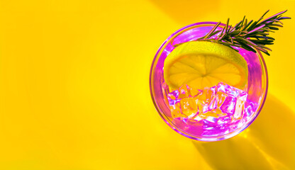 Neon colours image of lemonade with ice cubes 