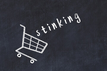 Chalk drawing of shopping cart and word stinking on black chalboard. Concept of globalization and...
