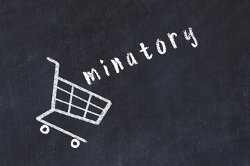 Chalk drawing of shopping cart and word minatory on black chalboard. Concept of globalization and...