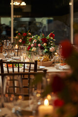 transparent wine glasses on a beautiful festive table decorated with flowers