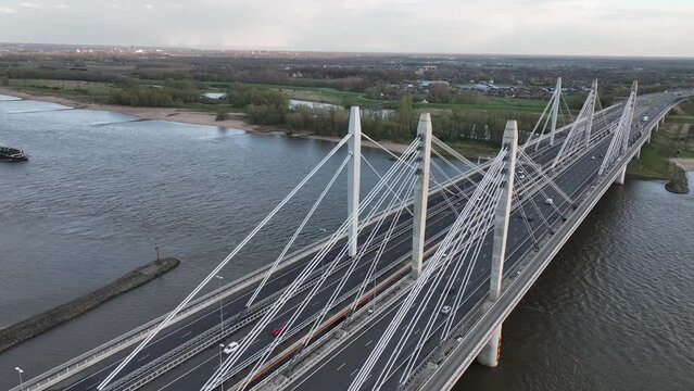 Road surface and traffic on Tacitusbrug bij Ewijk modern suspension bridge crossing the river Waal near Nijmegen, the Netherlands Holland Europe. Valburg and Ewijk.