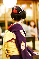 Maiko apprentice showing Japanese traditional dance. Maiko is an apprentice geisha. Maikos...