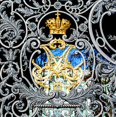 Golden imperial crown of Russian empire monogram at Winter Palace