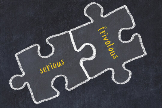 Concept of dealing with troubles. Chalk sketch of connecting puzzles with words serious and frivolous