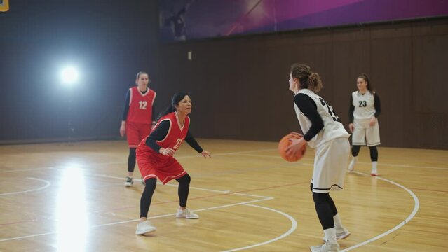 Woman power, basketball championship, female player makes an failure attempt to throw the ball into the basket, the confrontation of two females team of basketball players, training game, 4k slow