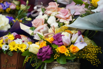 Obraz na płótnie Canvas Bright bouquets of flowers with decorative paper on sale.