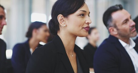 Broadening their knowledge and expertise in their field of work. 4k video footage of a young businesswoman sitting in a conference meeting.