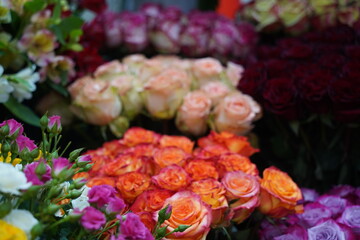 Bright bouquets of flowers with decorative paper on sale.