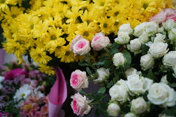 Bright bouquets of flowers with decorative paper on sale.
