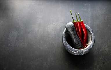 Pepper. Hot pepper in a mortar.