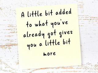 Wise quote on sticky note on wooden wall