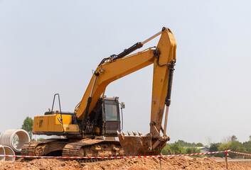 Excavator in construction site, Excavator dig the trenches at a construction site. Trench for laying external sewer pipes.