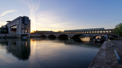 Bercy bridge and Ministry of Economy in the 12th arrondissement of Paris city - obrazy, fototapety, plakaty