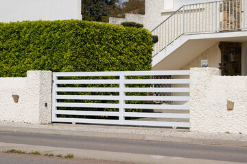 white classical home door aluminum gate sliding slats portal garden entry suburb house