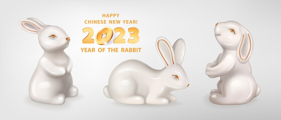 Rabbit is a symbol of the 2023 Chinese New Year. Set of three figurines of white ceramic Rabbits isolated on a white background. Vector realistic 3D illustration of decorative Bunny