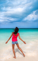 Fototapeta na wymiar Young African American female enjoying Bahamas beach vacation
