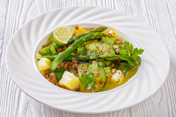 alkaline green soup in white bowl, top view