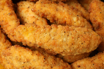 Chicken strips on whole background, close up