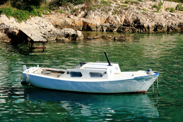 Fototapeta na wymiar white boat in the bay, Valdarke, island Losinj, Croatia