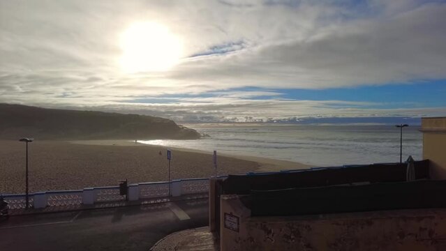 Time lapse of a sunset at the nearby the ocean. Sintra coast at Portugal. Sunset clouds moving over the beach. Beautiful sunset in sunny tropical beach. Fog moving from the ocean to the coast. 