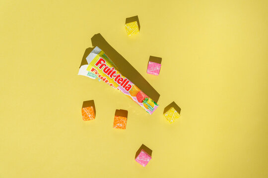 Tyumen, Russia-April 03, 2022: Fruittella chewing gum and candy on a yellow background