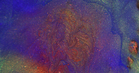 Color fluid mix. Glitter ink flow. Sparkling oil paint. Blur fluorescent purple blue orange shiny particles floating liquid abstract art background.