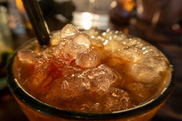 Ice on a colorful drink