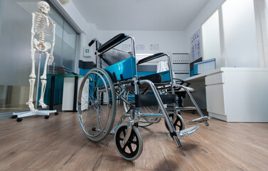 Medical wheelchair standing in empty doctor office used for invalid patient during illness...