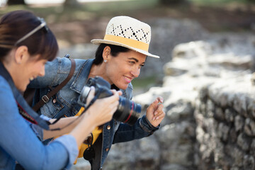 happy traveler women photographer taking pictures