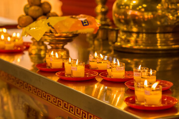 Bangkok, Thailand - January, 26, 2022 : Praying and meditation with burning candle on Chinese temple in Wat Leng Nei Yee 2 Temple at Bangkok, Thailand.
