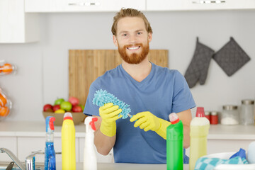 happy man washing-up at home