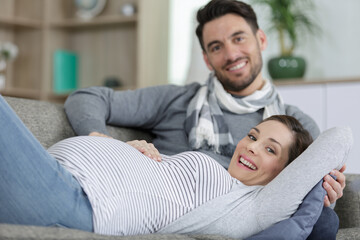 young pregnant woman with her husband