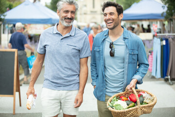men are walking in the market