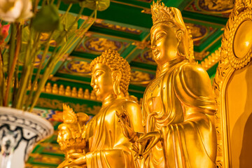 Bangkok, Thailand - January, 26, 2022 : Golden Buddha statue in Leng Noei Yi 2 or Mangkon Temple in Bangkok, Thailand.