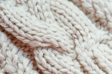 texture of knitted angora fabric. beige wool texture. Knitted jersey background with relief pattern for wallpaper and abstract background. Wool hand- machine, handmade