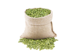 Pumpkin seeds in a sack isolated on a white background. Pumpkin seeds in burlap sack. Pumpkin seeds...
