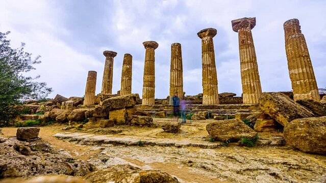 Time lapse shot of tourist couple visiting famous historic Valle Dei Templi a archaeological site in Agrigento