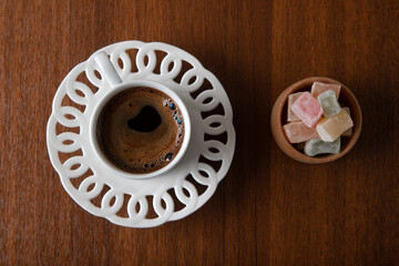Traditional Turkish delight and Turkish coffee on a wooden background,top view

