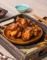 Rabbit meat on a wooden plate