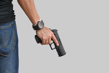 Isolated 9mm pistol gun holding in right hand of gun shooter with clipping paths.