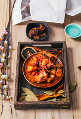 Rabbit meat on a wooden plate