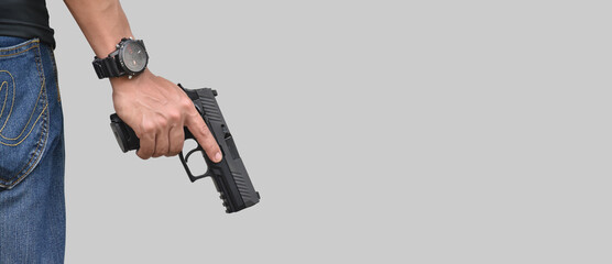 Isolated 9mm pistol gun holding in right hand of gun shooter with clipping paths.