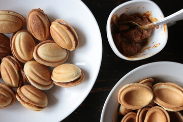 Manual production of flour confectionery or cookies in the form of nuts